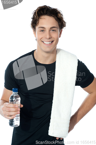 Image of Handsome muscular man with towel