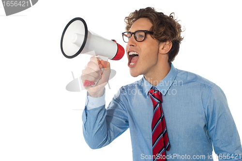 Image of Young businessman using megaphone