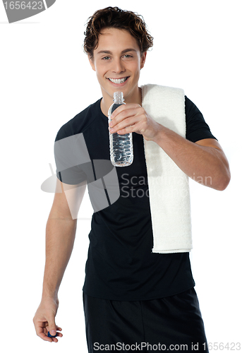 Image of Fit man drinking water isolated on white