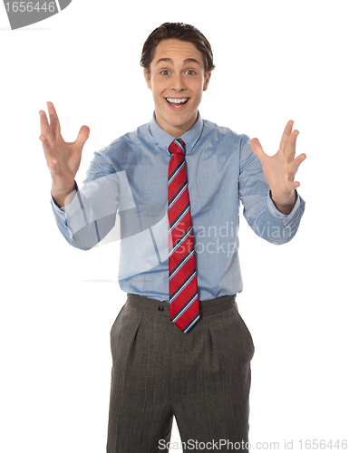 Image of Excited male executive posing