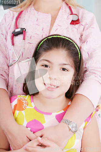 Image of nice doctor with little girl