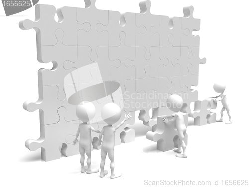 Image of business teamwork - business men making a puzzle over a white ba