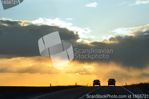 Image of cars at sunset