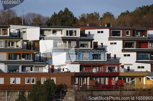 Image of new modern architecture at frozen riverside in winter