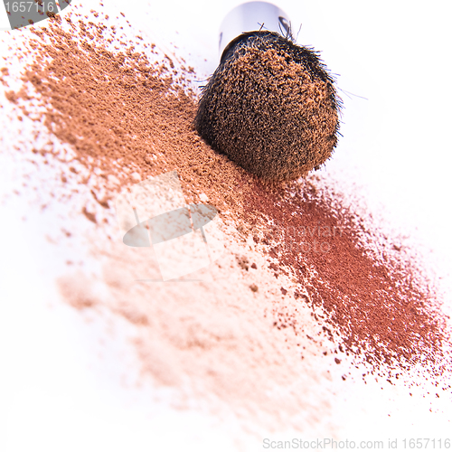 Image of makeup brush and powder