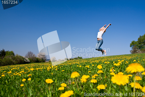 Image of happy young woman on meadow