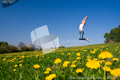 Image of happy young woman on meadow