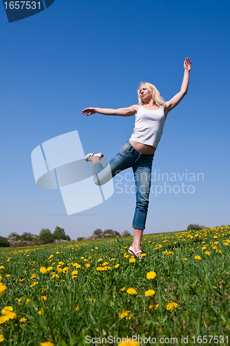 Image of happy young woman on meadow