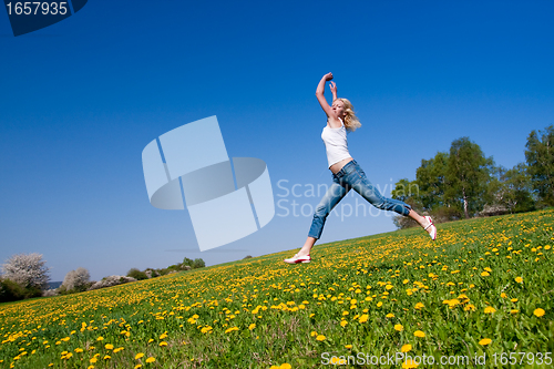 Image of happy young woman on meadow