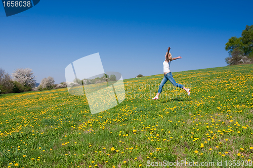 Image of happy young woman on meadow