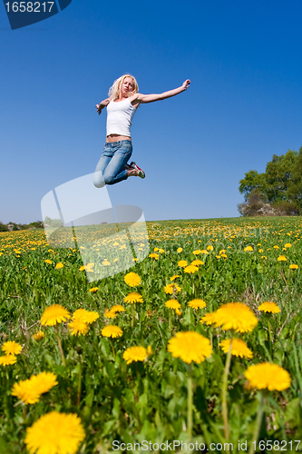 Image of happy young woman on meadow