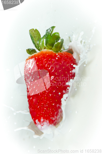 Image of strawberry splashing into milk