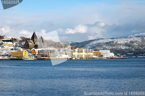 Image of new modern architecture at frozen riverside in winter