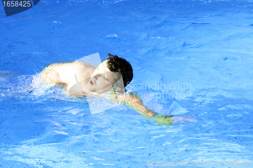 Image of young sports swimmer in pool