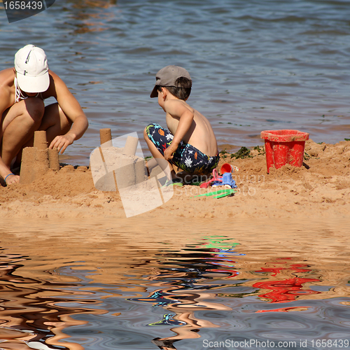 Image of sandcastle building in the beach
