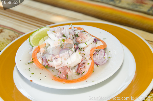 Image of   Spanish seafood salad appetizer tapas shrimp ocotpus caracol c