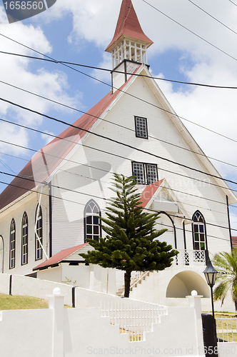 Image of First Baptist Church  with tropical tree La Loma town  San Andre