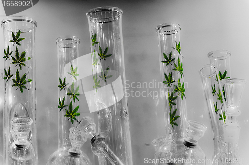 Image of Water pipes with weed marijuana logo
