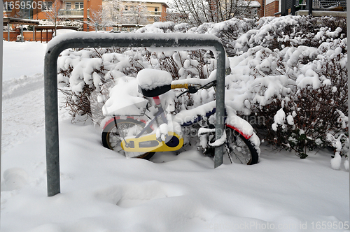 Image of Children's bicycle in the snow.