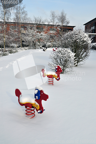 Image of Children's playground in the snow