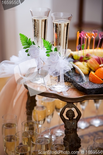 Image of glasses with champagne for groom and bride