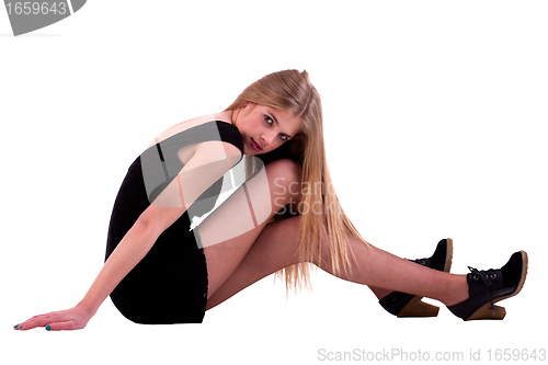 Image of Beautiful blonde woman on the floor