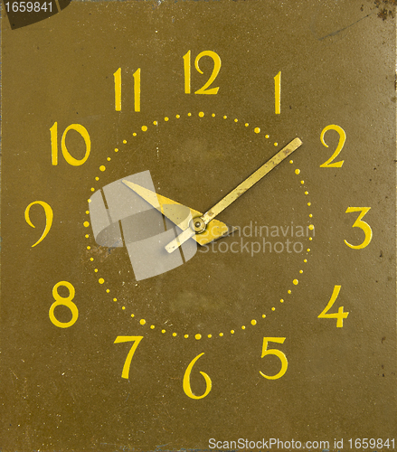 Image of ancient mechanical clock arrows number of hours 