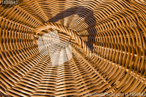 Image of Background of hand-woven basket reed lid handle 