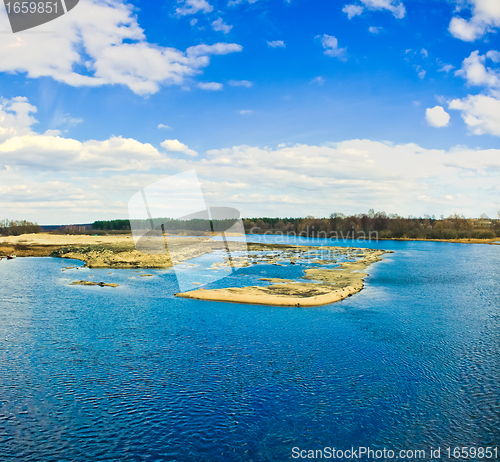 Image of Island with trees on blue cold lake