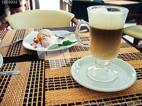 Image of Breakfast with coffee latte macchiato and croissants