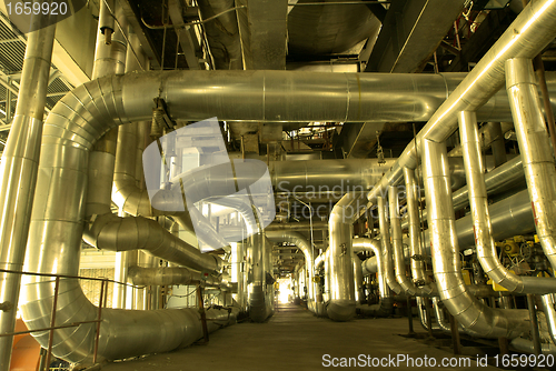 Image of Industrial zone, Steel pipelines and cables in yellow tones