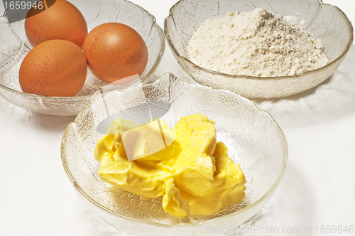 Image of baking ingredients,egg, margarine and flour