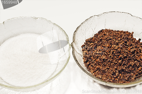 Image of baking ingredients, sugar and grated chockolate