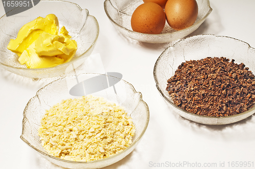 Image of baking ingredients,egg, margarine,almond,chocolate