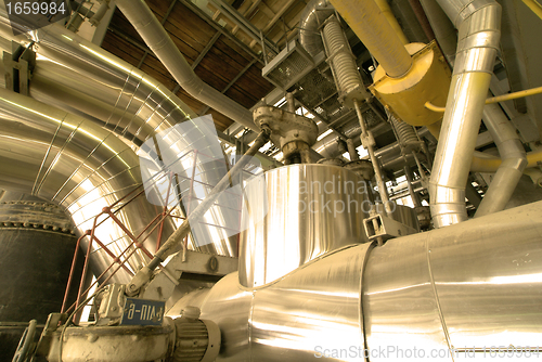 Image of Industrial zone, Steel pipelines and cables in yellow tones