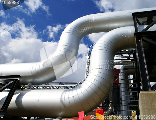 Image of Industrial zone, Steel pipelines and valves against blue sky