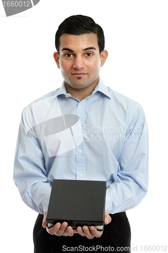 Image of Salesman holding a product or other object