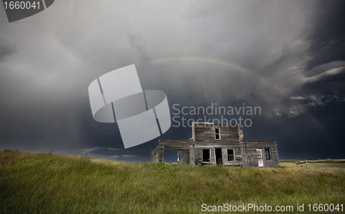 Image of Storm over abandoned farm house