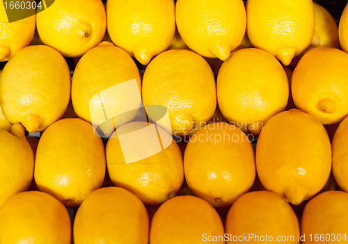 Image of yellow background, texture of many lemons in market