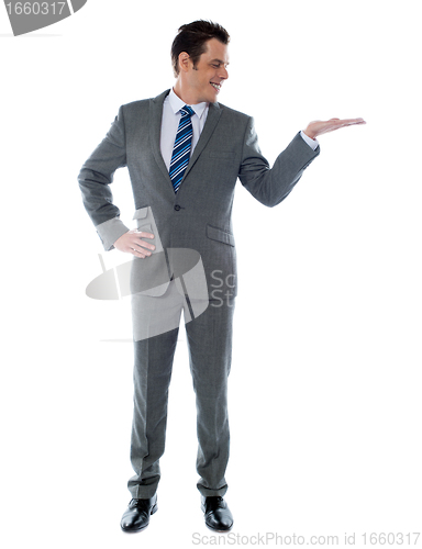 Image of Happy businessman giving presentation