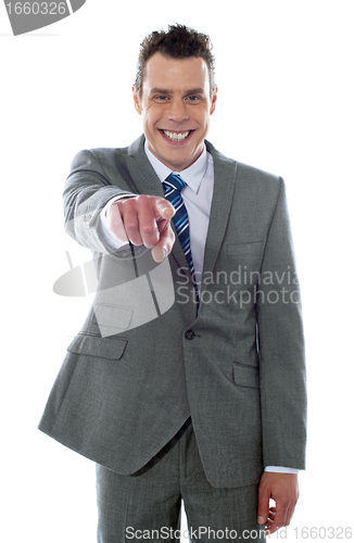 Image of Portrait of businessman pointing at you