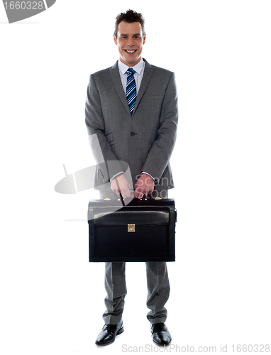 Image of Comany's CEO holding his handbag