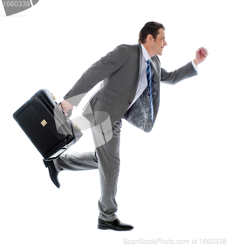Image of Businessman running with a briefcase