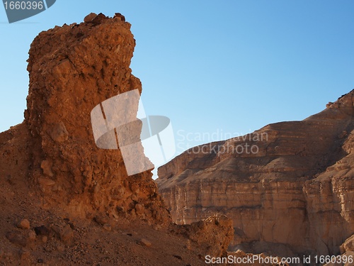 Image of Scenic pillar rock in a stone desert at sunset