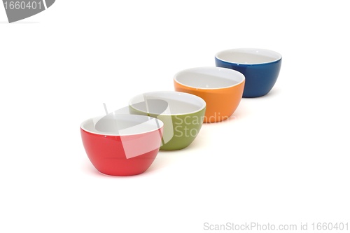 Image of Diagonal row of four porcelain bowls isolated