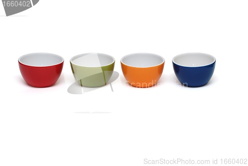 Image of Row of four porcelain bowls isolated