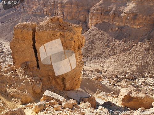 Image of Scenic cracked orange rock in stone desert