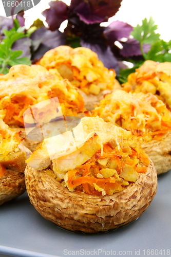 Image of Mushrooms stuffed with vegetables and chicken.