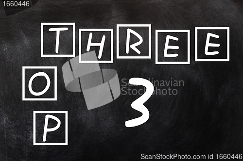 Image of Crossword of top three on a blackboard background