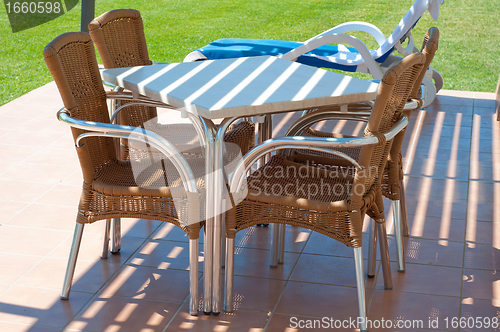 Image of Chairs and table near apartments